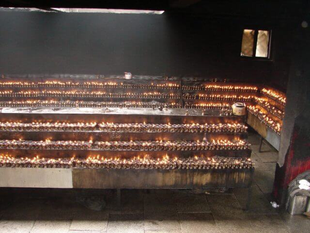 Hundreds of candles in the temple