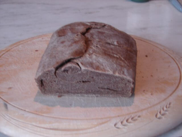 A deflated loaf of rye bread. 