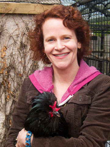 Portrait of Christine Heppermann holding a chicken