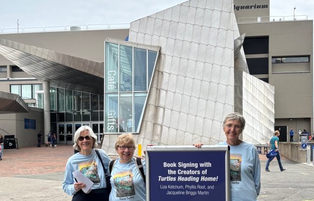 authors standing in front of NE Aquarium