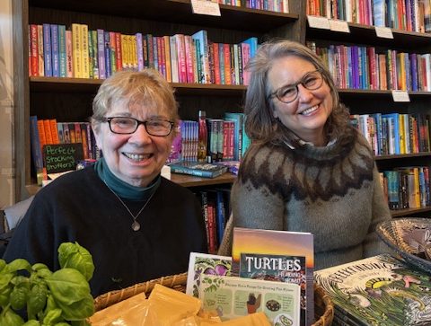 Two authors at a book event. On the left is Jacqueline Briggs Martin, on the right is Claudia McGehee.
