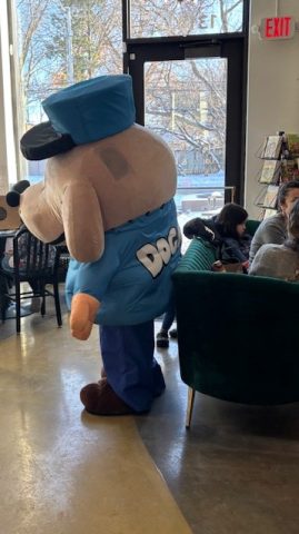 a book event mascot, a person dressed up as a police dog